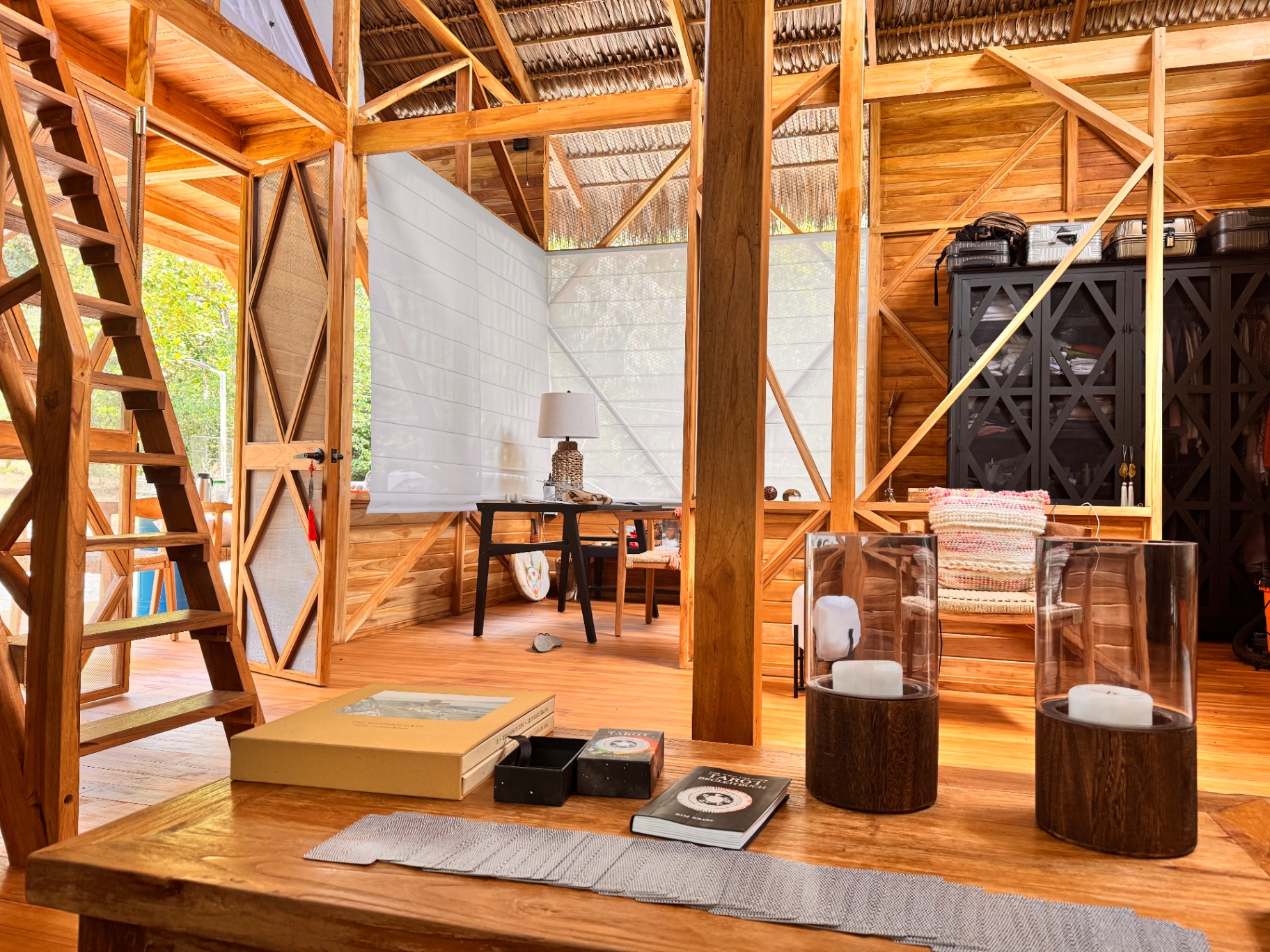 Inside the lodge — wood, thatch and light