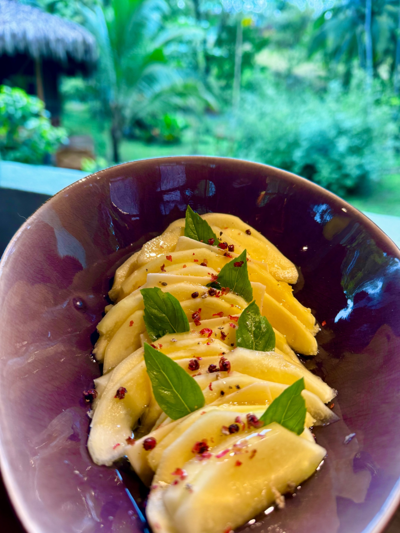 Green mango carpaccio with basil and pink pepper