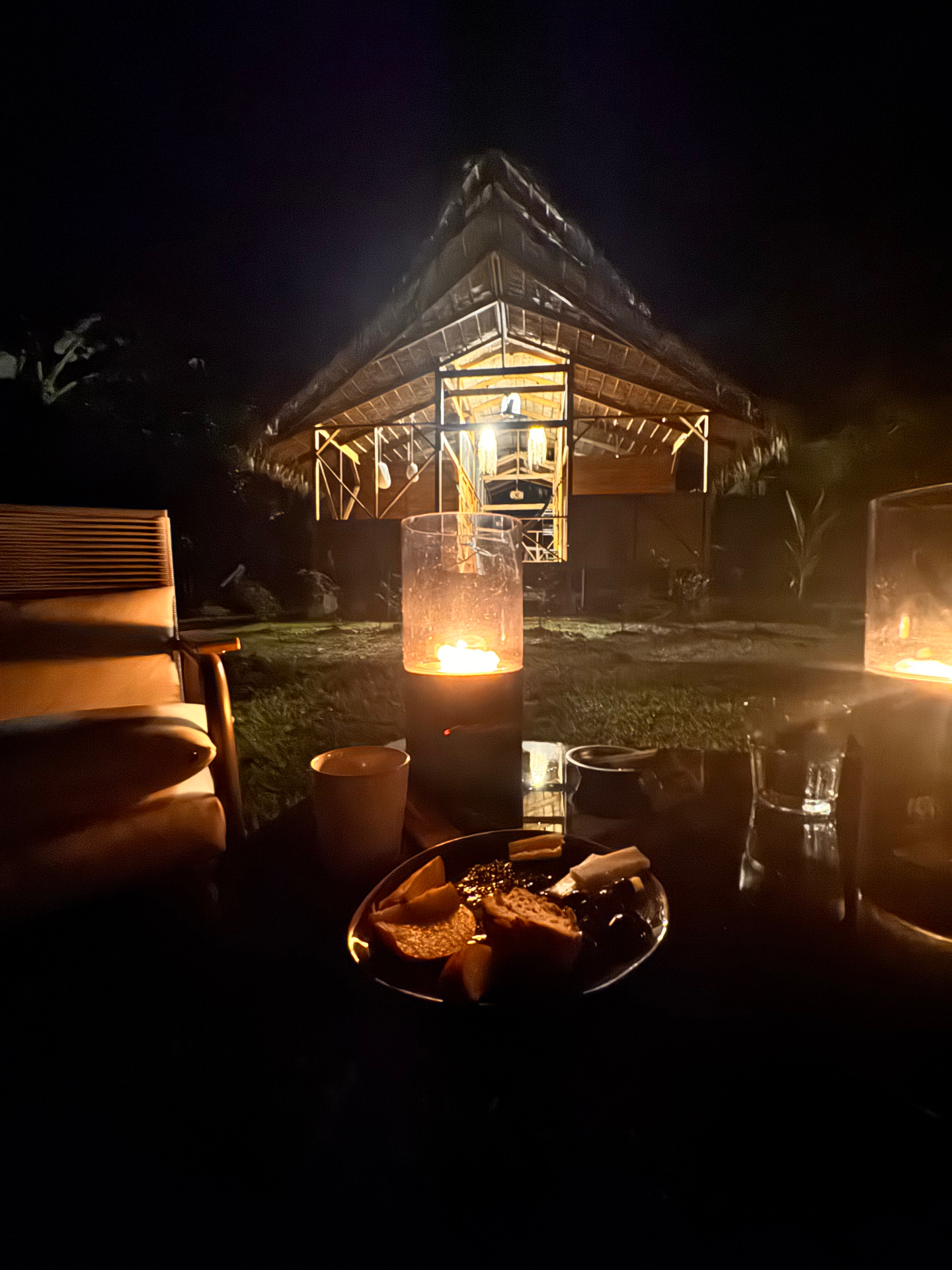 Candlelight on the deck with the lodge in the distance