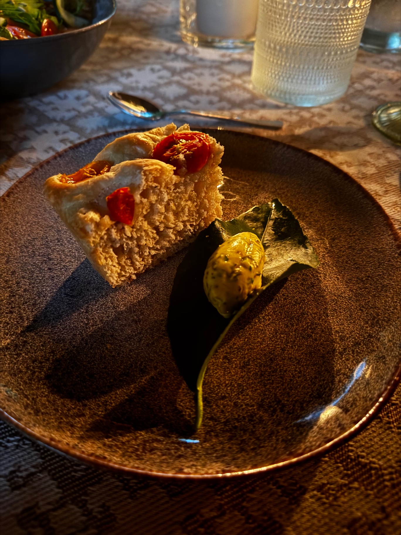 Focaccia with confit tomatoes and herb butter