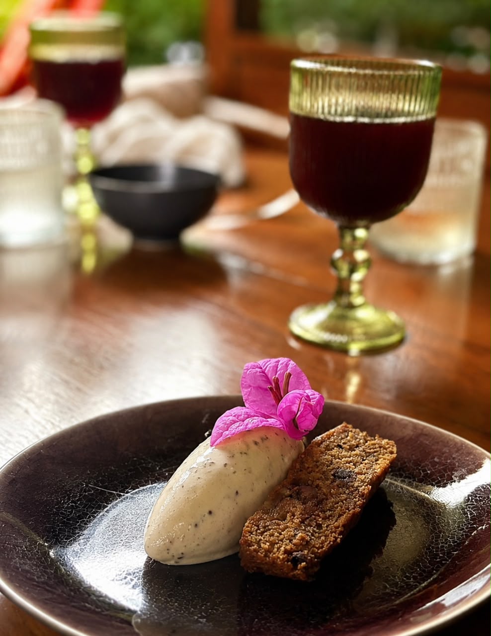 Ice cream with spice cake and bougainvillea flower, served at La Seta